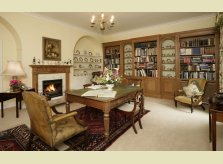 A Hallidays study with bookcases and Clarendon mantelpiece